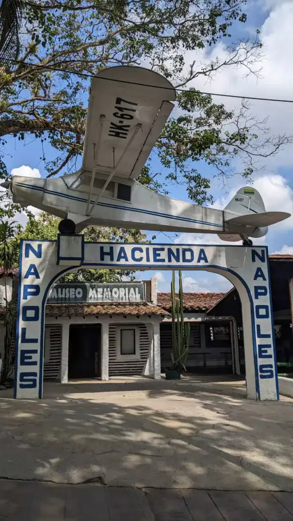 Hacienda Nápoles entrance gate with the small plane on top
