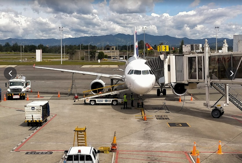 plane unloading behind MDE airport